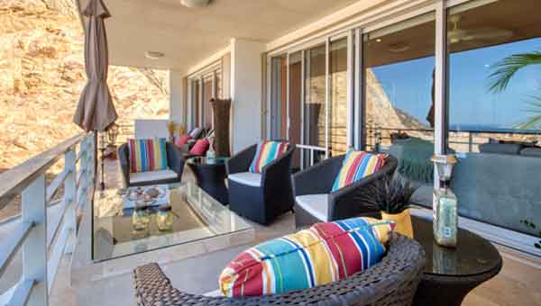 Terrace with ocean and city views at Las Cascadas condo 502 for sale